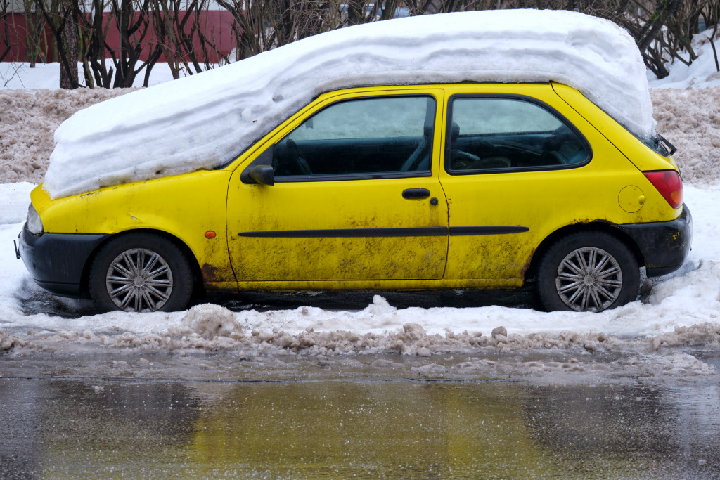 yellow car with snow on top