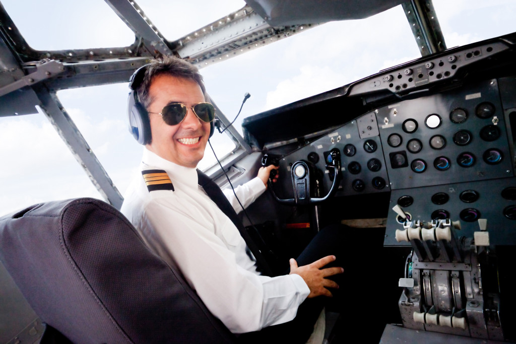 pilot cabin flying and smiling