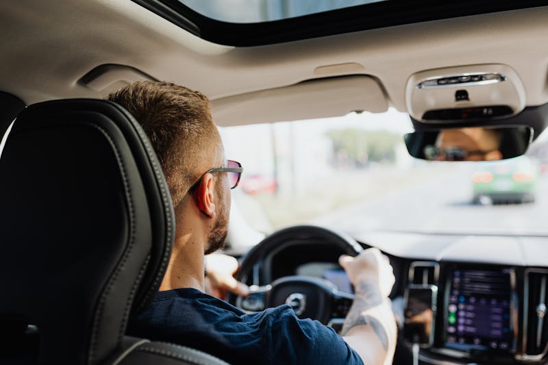 a man driving a car